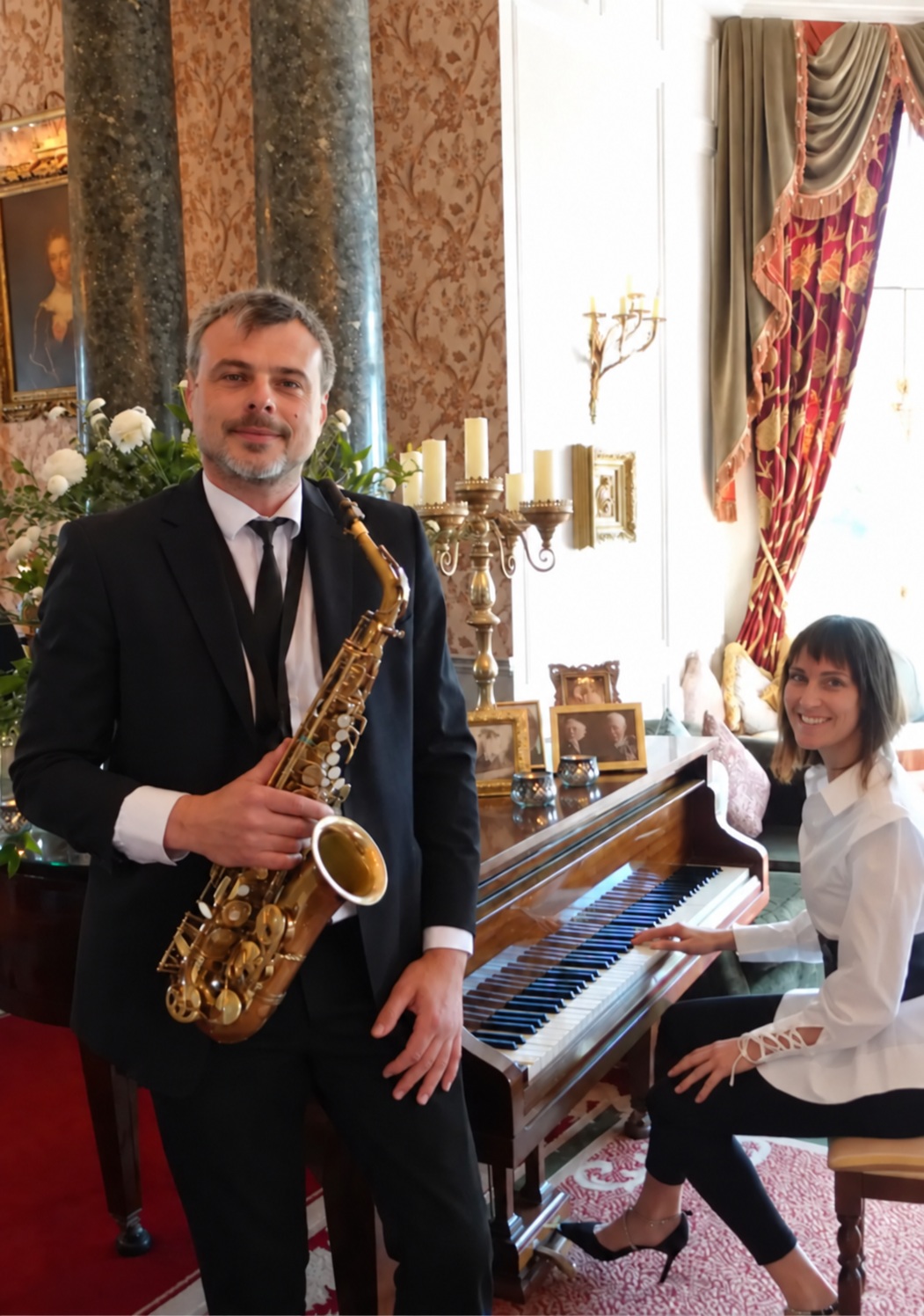 Saxophone and piano duo performing at an elegant wedding